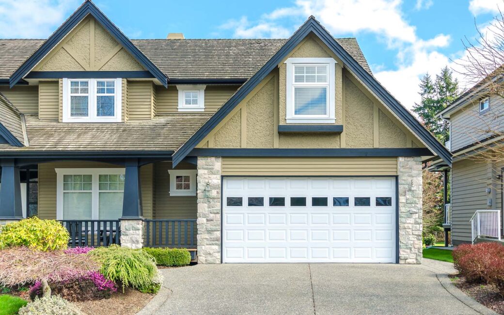 A serene daytime shot showcases a two-story home in a suburban neighborhood, bathed in natural light.