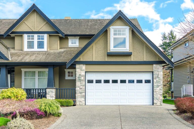 A serene daytime shot showcases a two-story home in a suburban neighborhood, bathed in natural light.