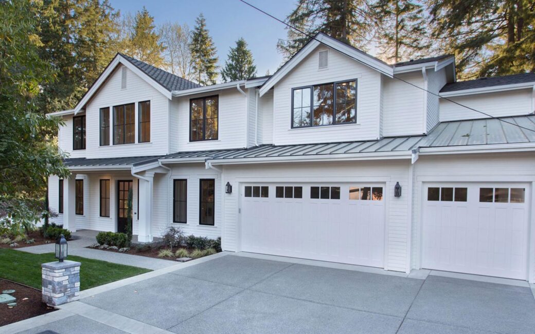 A beautiful two story home with a white garage door