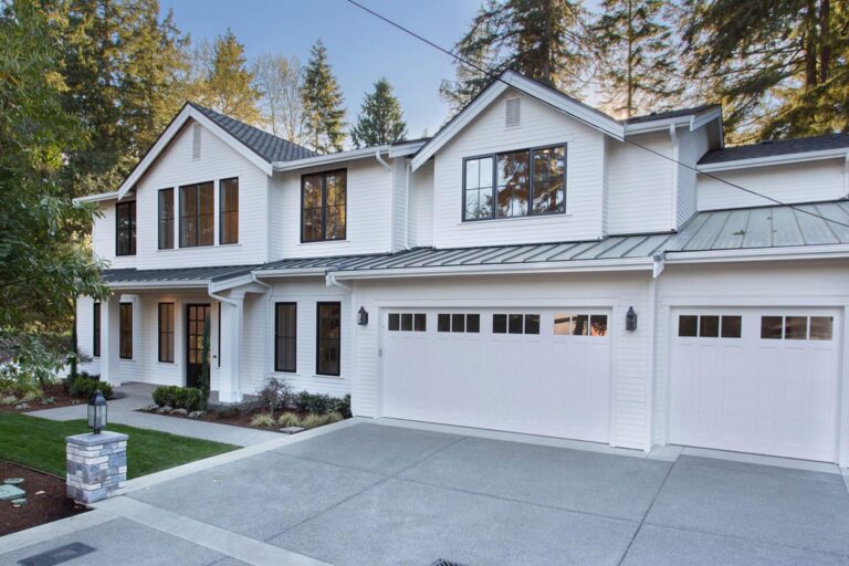 A beautiful two story home with a white garage door