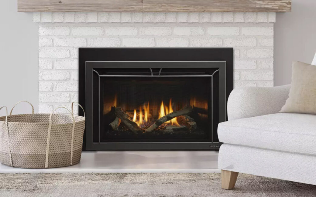 A gas fireplace insert with wood burning inside