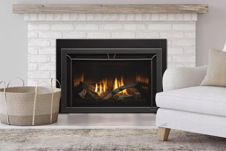 A gas fireplace insert with wood burning inside